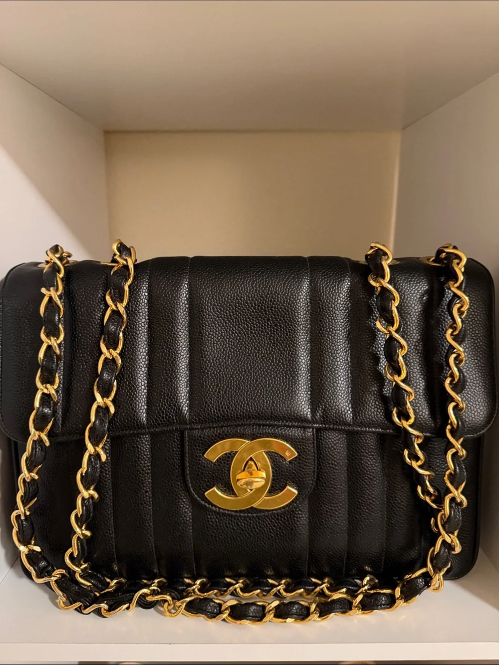 CHANEL Black Quilted Leather Shoulder Bag with Gold Chain and CC Lock